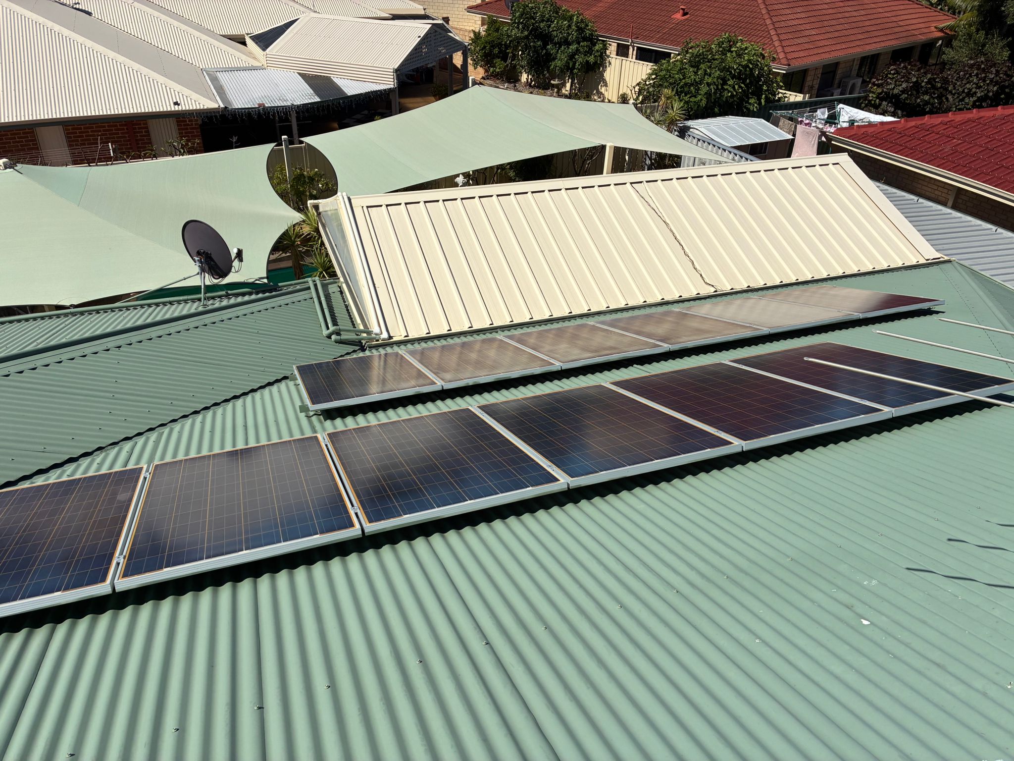 Solar panel cleaning in Bertram - 12 polycrystalline panels across two roof pitches on sage green Colorbond roof